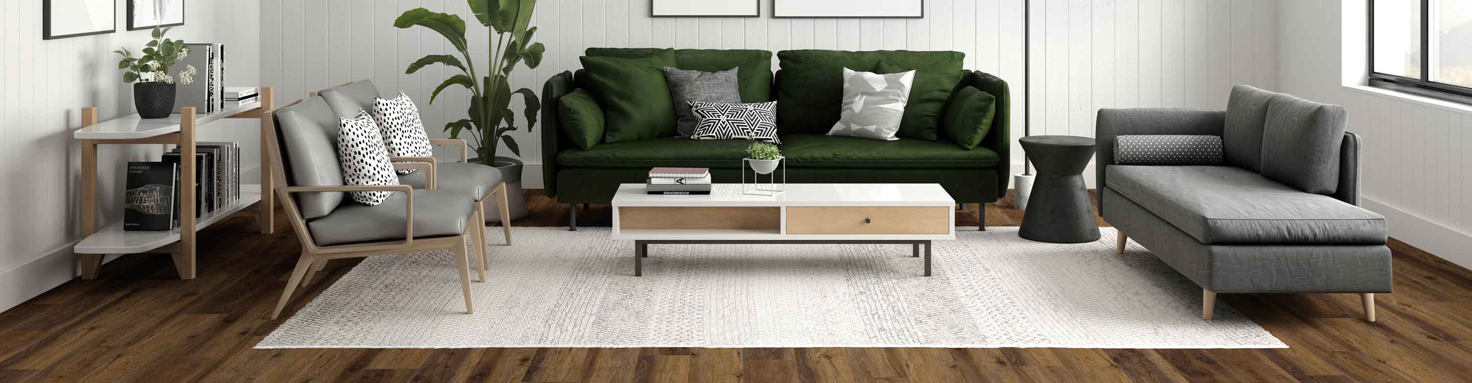 black and white pattered area rug in midcentury New Hampshire living room with green couch